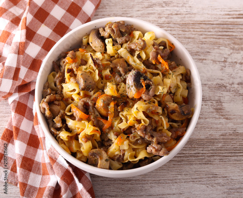 Pasta with mincemeat and mushrooms in  a bowl