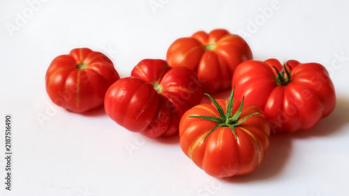 Photography Costoluto Genovese, a variety of Italian heirloom tomatoes known for its striking fluted shape and rich, tangy flavor