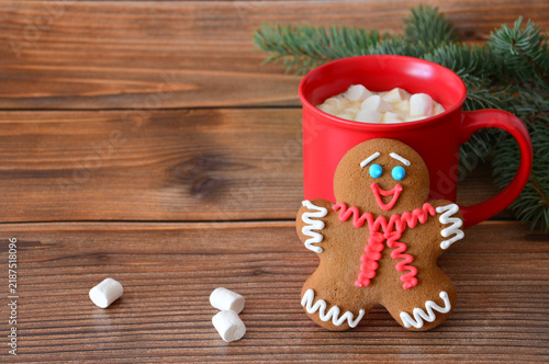 Gingerbread Man Cookie and Hot Chocolate in Red Mug on Wooden Table, christmas banner