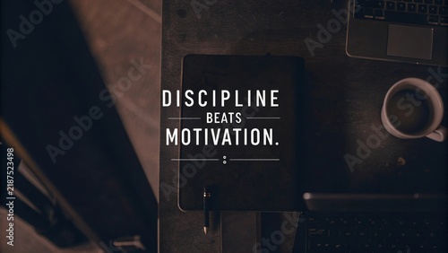 An inspiring workspace that emphasizes discipline over motivation showcasing a notebook and a cup of coffee on a desk symbolizing productivity and concentration