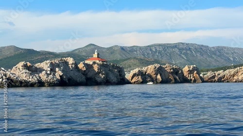 Grebeni Lighthouse on the Grebeni Islets near Dubrovnik in Croatia on the Adriatic Sea. Historic maritime navigation landmark guiding vessels along the Dalmatian coast.
