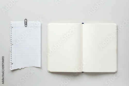 Notebook and paper with paperclip