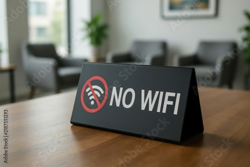 No wifi sign on a wooden table in a blurred office waiting room