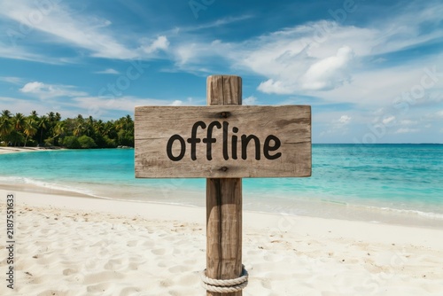 Wooden sign with the word offline on a beautiful tropical beach background