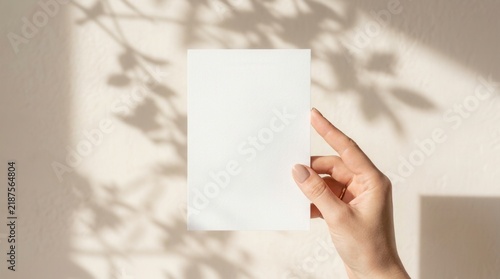 A blank holiday postcard mock-up for greeting card projects held by a person