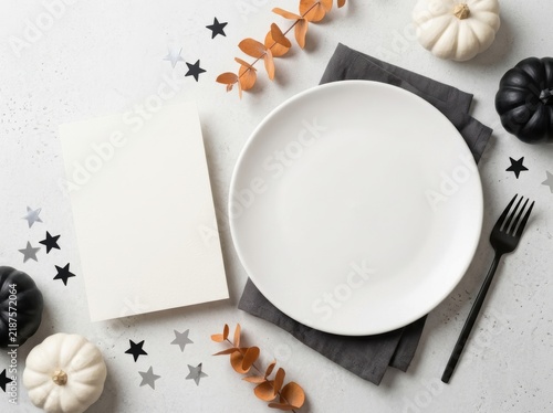 Professional Halloween Table Setting Mockup featuring Blank White Plate and Invitation Card for Custom Design with Decorative Pumpkins, Stars, and Eucalyptus Flat Lay