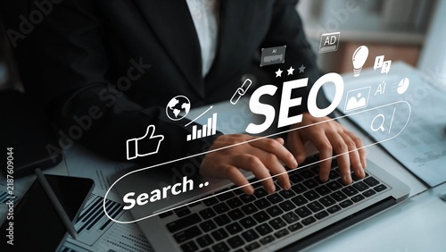 Cuadro en lienzo Individual typing on laptop keyboard focused on search engine optimization strategies with analytical icons illustrating digital marketing concepts and technologies Gluon