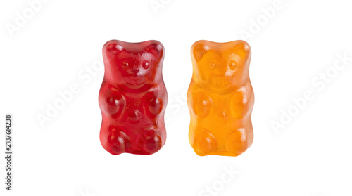 Two gummy bears, red and orange, isolated on transparent background