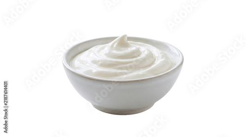 A small white bowl filled with creamy yogurt or sour cream isolated on transparent background