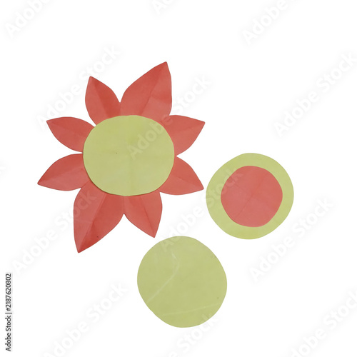 Принти на полотні A paper flower cutout with red petals and a yellow center alongside two addition