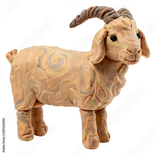 Handmade clay goat sculpture with swirled patterns and curved horns