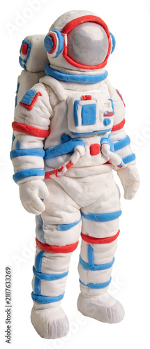 Handmade clay astronaut figure with white, blue, and red details