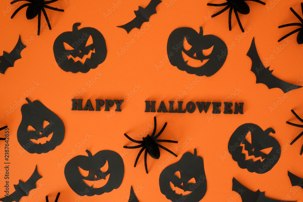 Naklejka premium Black jack-o'-lanterns, spiders, bats shapes and 
