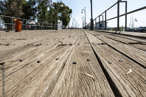 Wooden decking leading to a yacht pier on Embankment of Larnaca Marina in Cyprus