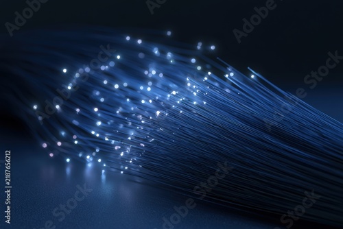 Glowing fiber optic cables with detailed light points on dark surface