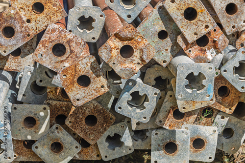 Stacked Rusted Scaffolding Base Plates Close-Up Showing Corrosion, Texture and Industrial Decay