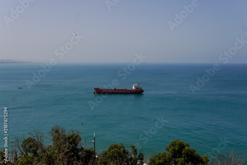 Quadro su tela Cargo ship navigating the blue Atlantic ocean near the coast of Safi, Morocco