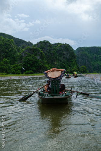 Traditional Boat Ride Through Trang An Karst Landscape, Vietnam