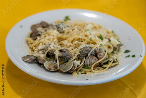 Spaghetti alle vongole with clams, parsley and parmesan served at a restaurant in Chioggia, Veneto, Italy