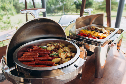 Fotografie Buffet chafing dishes holding hot food outdoors