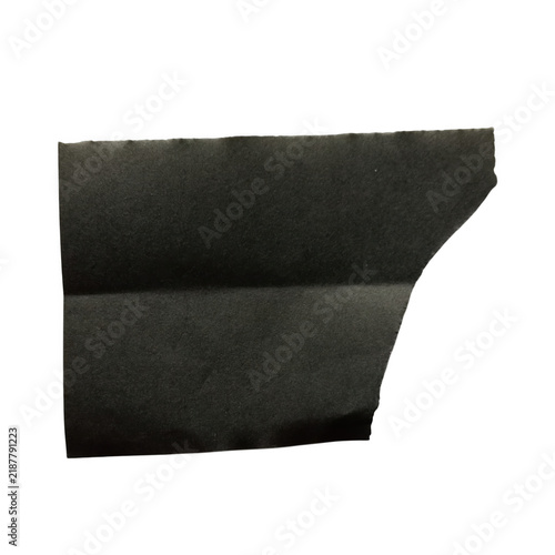 Foto Black torn paper scrap with rough edges, textured dark charcoal paper fragment,