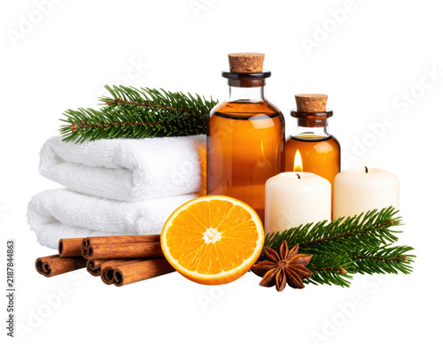 Spa composition with spa oil, candles, cinnamon, pine, and orange
