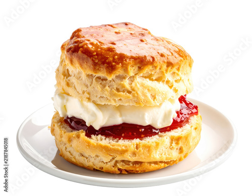 Freshly Baked Scone with Clotted Cream and Strawberry Jam on a White Plate
