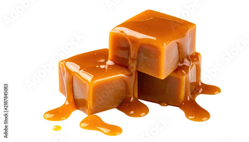 Three Caramel Cubes with Liquid Caramel Sauce Drizzled Over Them