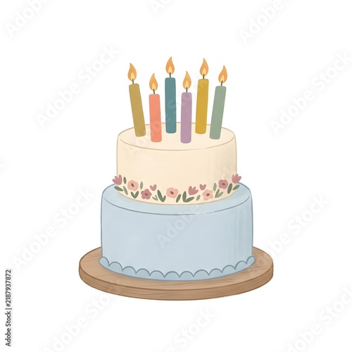 Cute two tier birthday cake with lit candles and floral decoration