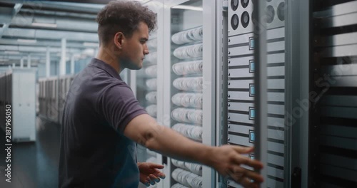 IT Specialist Holds Digital Tablet and Uses Keys to Open Glass Server Cabinet Door Inspect Cooling Fans and Hardware Components. System Diagnostics, Physical Maintenance Ensure Optimal Server Airflow.