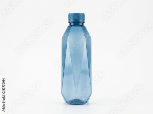 Single empty blue plastic water bottle with a faceted geometric shape and matching blue cap isolated on a plain white studio background