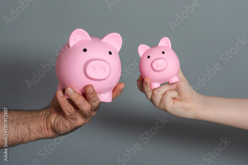 Konstfotografi Child saving with piggy bank