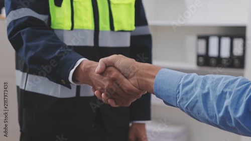 Close-up Of Person's engineer Hand Drawing Plan On Blue Print with architect equipment, Architects discussing at the table, team work and work flow construction concept