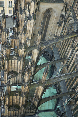High-angle view of the Gothic flying buttresses and stone details of St. Vitus Cathedral in Prague Castle, Czech Republic.