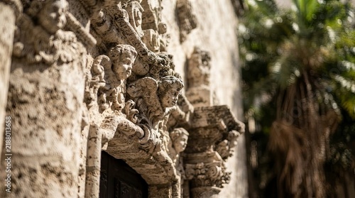 Ancient stone carvings on historic building facade