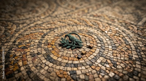 Ancient Roman mosaic floor with bird emblem