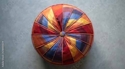 Round colorful fabric floor cushion from above
