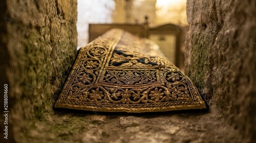 Ancient decorated tomb stone carving in historical building