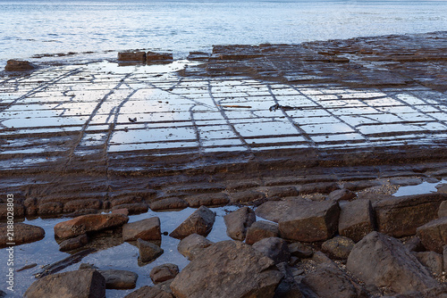 Tessellated pavement at Eaglehawk Neck, Tasmania, illustrating the pan formation of tessellation