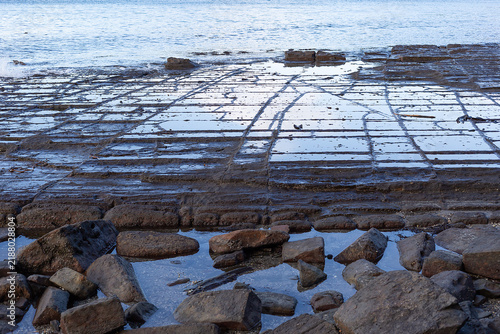 Tessellated pavement at Eaglehawk Neck, Tasmania, illustrating the pan formation of tessellation
