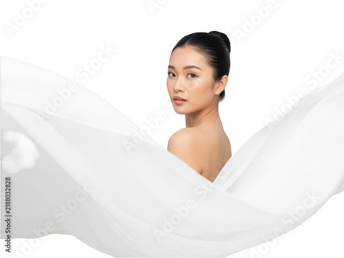 Woman with closed eyes relaxing in soft light