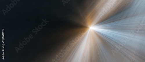 Luminous headlight trails in blue and amber erupting across a dark background, a glowing abstract burst for winter car maintenance and safety