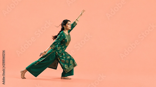 Indian Woman Performing Dynamic Traditional Dance Movement