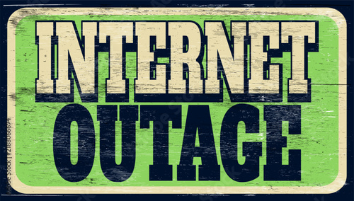 Aged vintage internet outage sign on wood