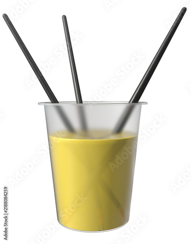 Three black paint brushes rinsing in clear plastic cup with yellow paint water. Artist studio tool for painting and brush cleaning