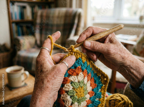 Hands Crocheting Colorful Yarn for Handmade Textile Craft