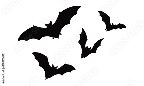 Group of four flying bats silhouettes