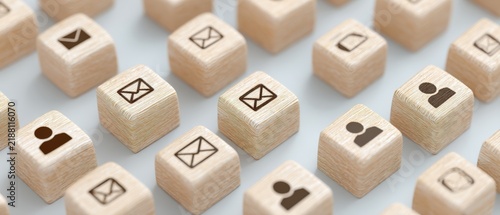 Wooden blocks with communication icons displayed in a patterned arrangement for social media and networking concepts