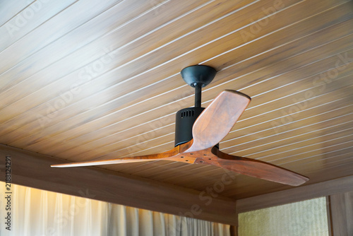 Modern electric wooden ceiling fan for indoor use.