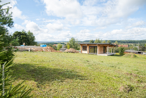 Принти на полотні Timber cabin with panoramic windows on a sunny hillside